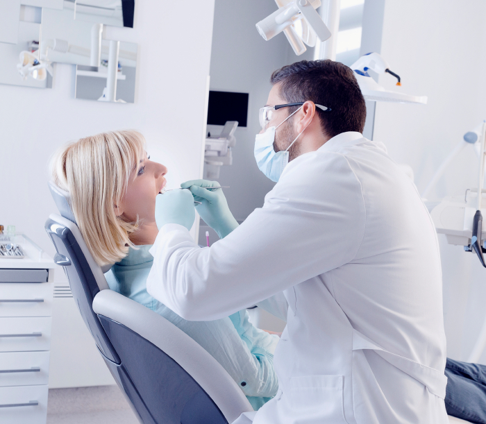 Dentist treating dental patient