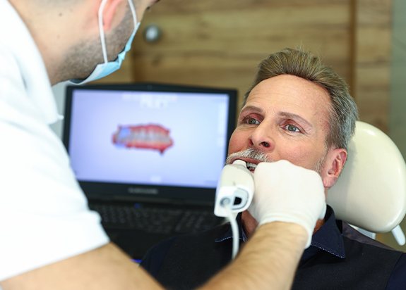 Patient receiving denture examination
