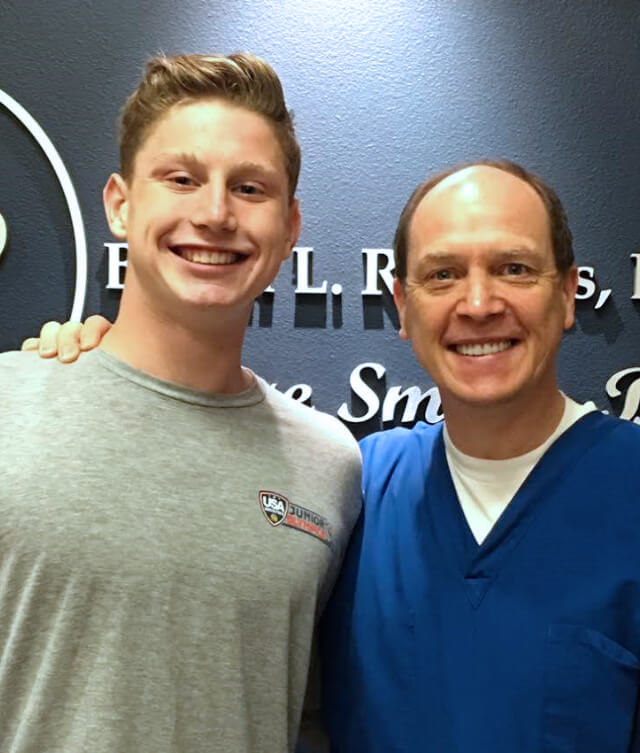 Fresno dentist and patient smiling in dental office