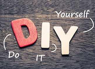 Wooden “D” “I” “Y” letters on wooden surface