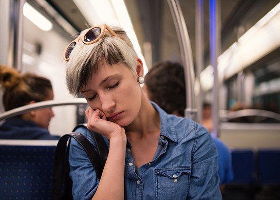 Woman falling asleep on a train