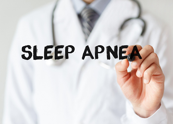 doctor writing sleep apnea on board