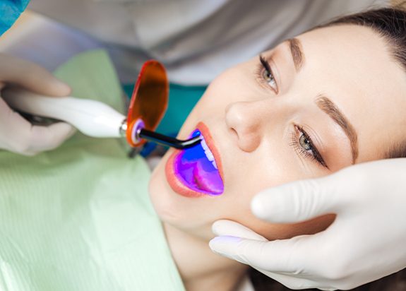 Woman receiving dental bonding treatment