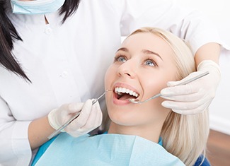 Woman listening to dentist in Fresno