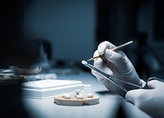 a dentist making a crown