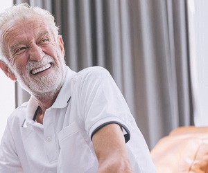 Man with dentures laughing