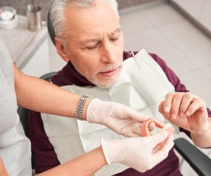 Man at the dentist getting dentures