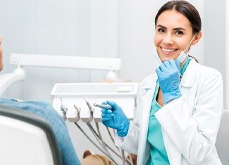 dentist smiling toward the camera