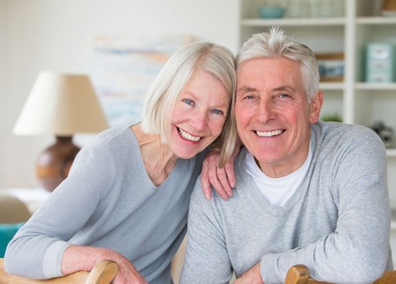 happy elderly couple with dental implants in Fresno 