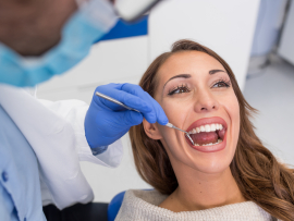 Woman receiving preventive dentistry exam