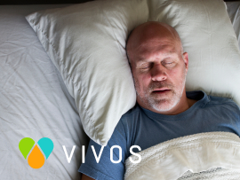 Man sleeping soundly with Vivos logo
