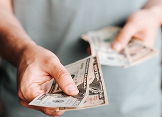 Man holding money for payment