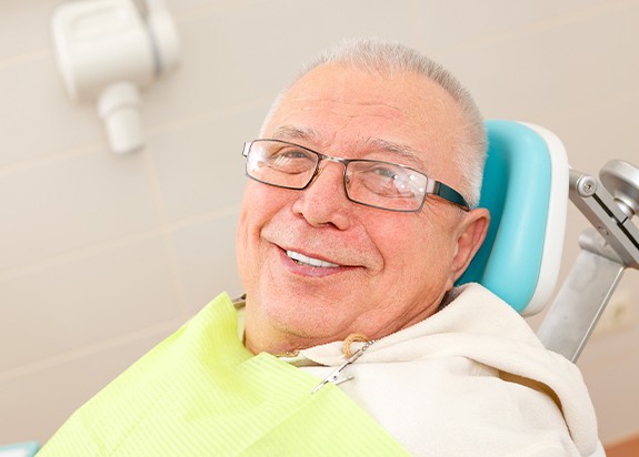 Man smiling during dental checkup and teeth cleaning visit