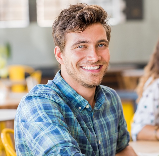 Man with healthy smile after root canal therapy