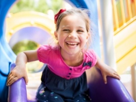 Little girl laughing after children's dentistry visit