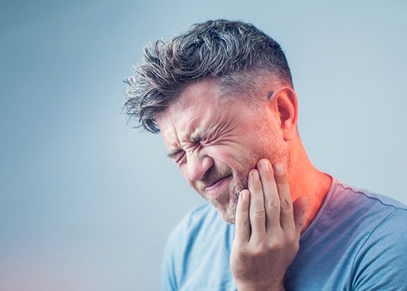 man with pain radiating from his jaw joints 