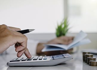 Man calculating cost of veneers in Fresno