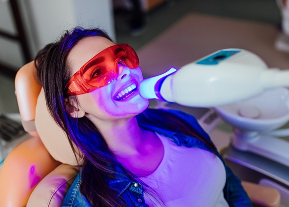 Female patient receiving in-office teeth whitening in Fresno, CA