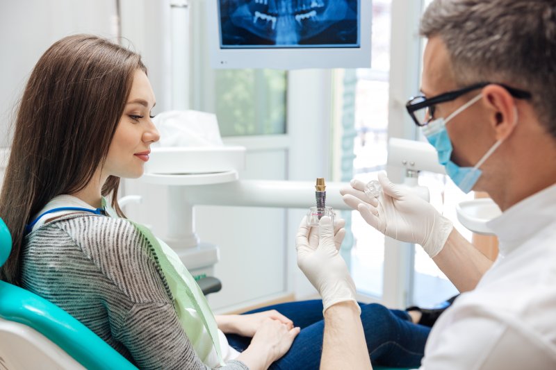 A woman attending a dental implant consultation
