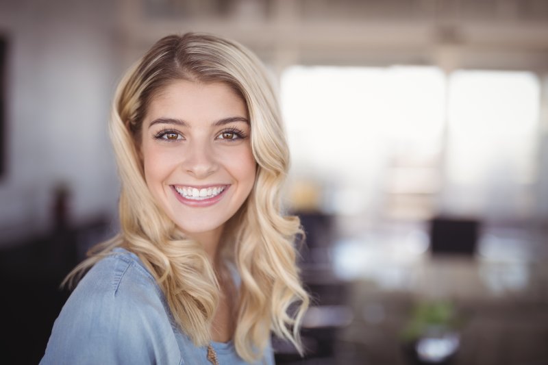 woman with dental crowns in Fresno