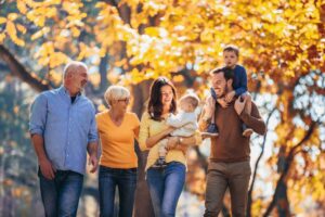 Three generations of a family walking outside