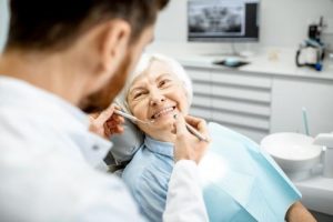 Older patient with dentures in Fresno