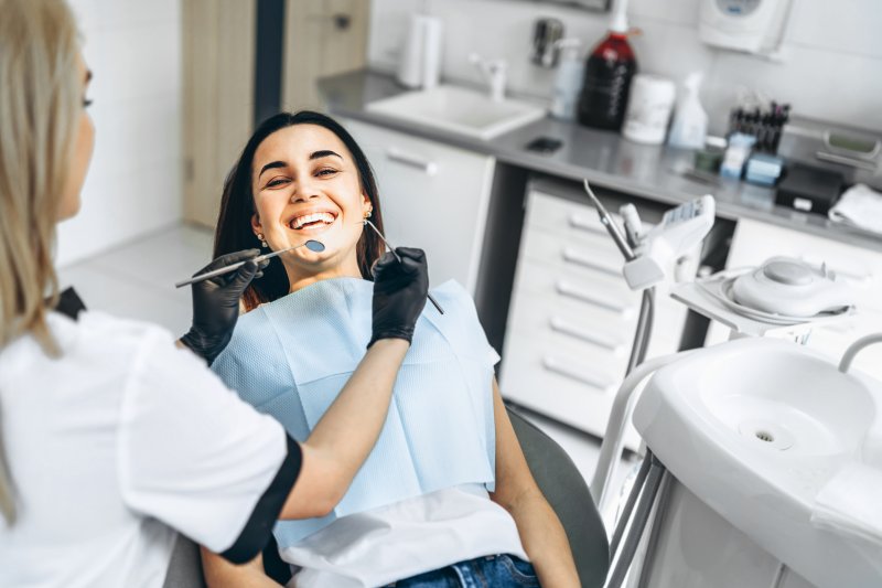 Patient smiling at dentist after cosmetic dentistry
