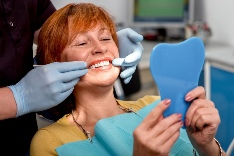 A patient receiving dental implants after tooth extraction